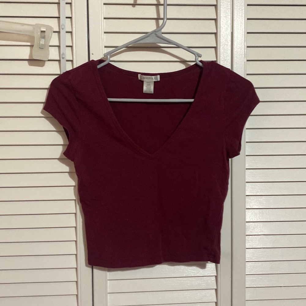 woman’s small burgundy shortsleeved shirt